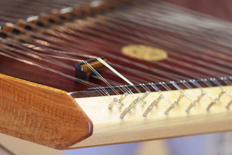 This hammer dulcimer shows the beauty of the Curly Koa wood (brown top rail) and Maple, which holds the tuning pins that secure the metal strings. (Cat Rooney /The Epoch Times) This hammer dulcimer shows the beauty of the Curly Koa wood (brown top rail) and Maple, which holds the tuning pins that secure the metal strings. (Cat Rooney /The Epoch Times)