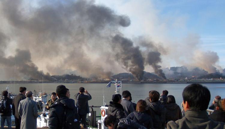 This picture taken on Nov. 23, 2010, by a South Korean tourist shows huge plumes of smoke rising from South Korea's Yeonpyeong Island due to an artillery attack from North Korea. (STR/AFP/Getty Images) This picture taken on Nov. 23, 2010, by a South Korean tourist shows huge plumes of smoke rising from South Korea's Yeonpyeong Island due to an artillery attack from North Korea. (STR/AFP/Getty Images)