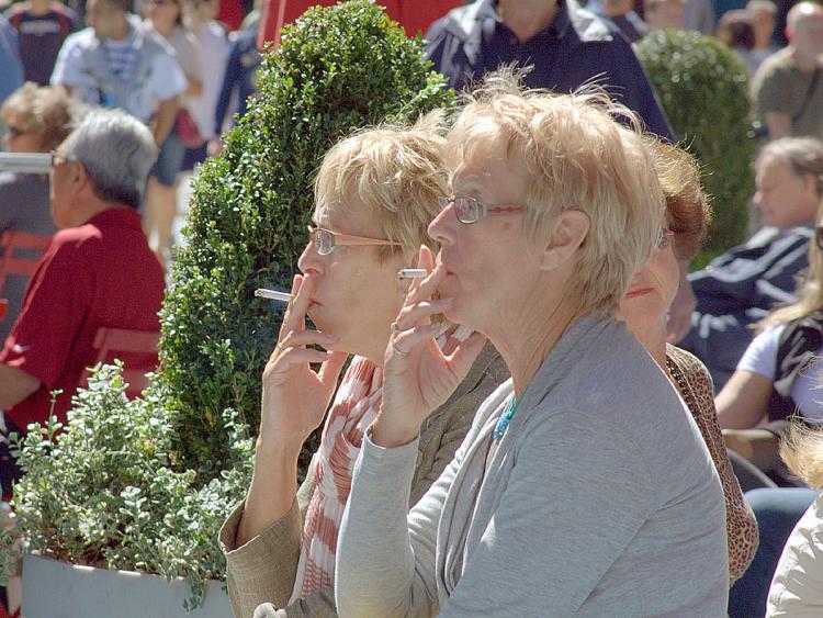 SHARING A PUFF: Two women have a smoke on Times Square on Wednesday. New legislation expanding the Smoke-Free Air Act of 2002 may soon include city parks and beaches. (Ben Kaminsky/The Epoch Times) SHARING A PUFF: Two women have a smoke on Times Square on Wednesday. New legislation expanding the Smoke-Free Air Act of 2002 may soon include city parks and beaches. (Ben Kaminsky/The Epoch Times)