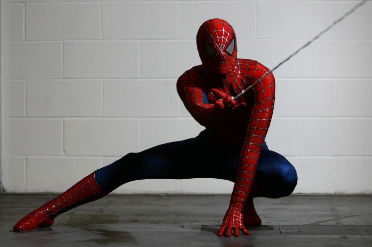 An actor dressed as Spiderman poses for a photo. (Jordan Mansfield/Getty Images)
