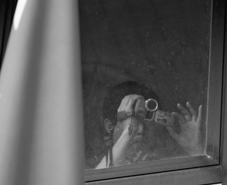 An employee of China's consulate in Rio de Janeiro, Brazil, records from a window a protest in front of the consulate on March 26, 2008. An espionage incident only weeks prior to chancellor Angela Merkel's planned China visit may be threatening the bilateral relations between Berlin and Beijing said German news magazine Spiegel Online in a June 26 article. (Antonio Scorza/AFP/Getty Images) An employee of China's consulate in Rio de Janeiro, Brazil, records from a window a protest in front of the consulate on March 26, 2008. An espionage incident only weeks prior to chancellor Angela Merkel's planned China visit may be threatening the bilateral relations between Berlin and Beijing said German news magazine Spiegel Online in a June 26 article. (Antonio Scorza/AFP/Getty Images)