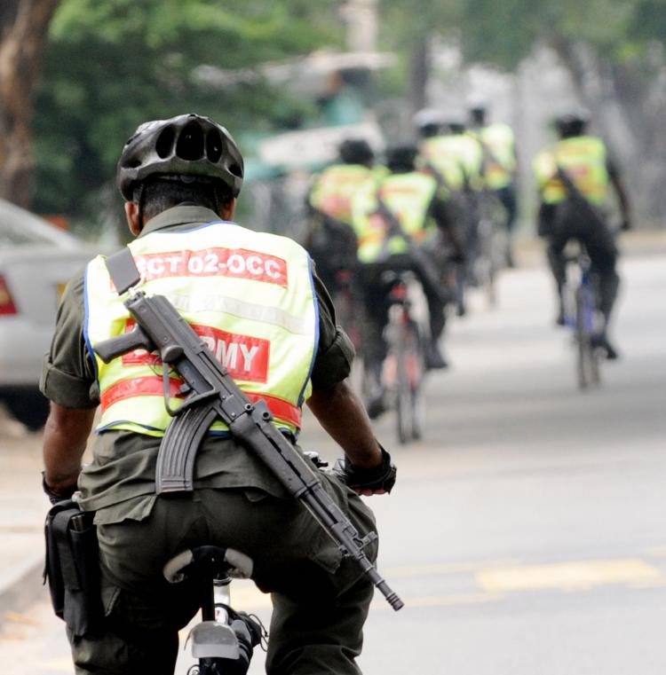 Sri Lankan security forces personnel patrol on bicycles in Colombo on January 26, 2009 a day after the army captured the Tamil Tigers' last outpost in Mullaittivu. Sri Lanka's army chief Sarath Fonseka has vowed to finish the decades old war in April. (Ishara S. KODIKARA/AFP/Getty Images) Sri Lankan security forces personnel patrol on bicycles in Colombo on January 26, 2009 a day after the army captured the Tamil Tigers' last outpost in Mullaittivu. Sri Lanka's army chief Sarath Fonseka has vowed to finish the decades old war in April. (Ishara S. KODIKARA/AFP/Getty Images)