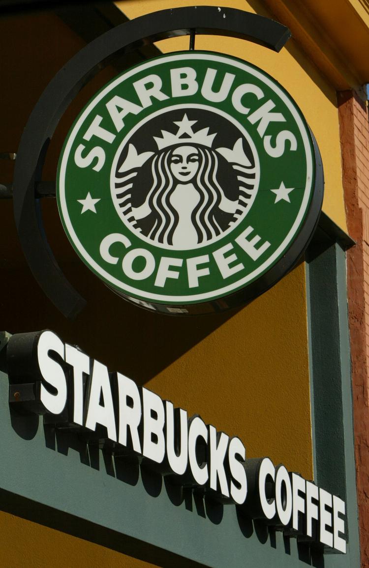 DISMAL REPORTS: Signs are seen in the front of a Starbucks coffee shop January 22, 2004 in San Francisco, California. In an effort to cut costs, the coffee chain announced July 29, 2008 that it was laying off 1000 non-store employees. (Justin Sullivan/Getty Images)