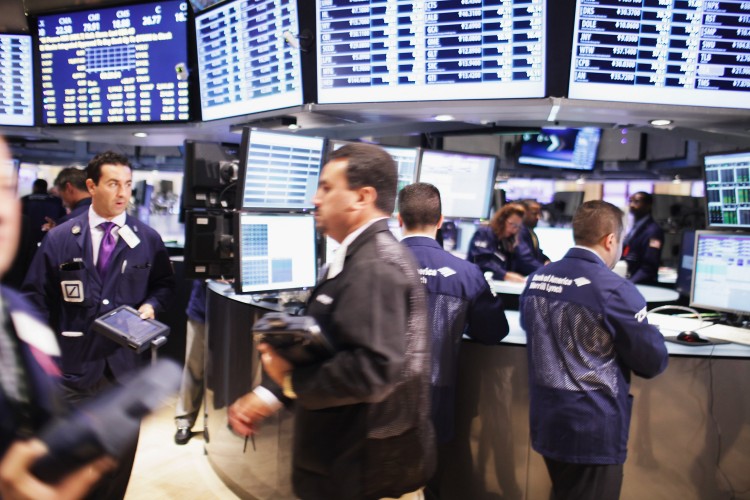 SOARING: Traders work on the floor of the New York Stock Exchange. Stocks soared on Tuesday, in the biggest one-day gain in almost two weeks. (Spencer Platt/Getty Images) SOARING: Traders work on the floor of the New York Stock Exchange. Stocks soared on Tuesday, in the biggest one-day gain in almost two weeks. (Spencer Platt/Getty Images)