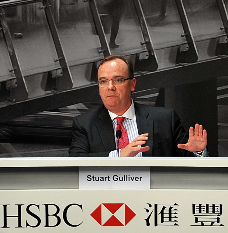 REVERSAL OF FORTUNE: HSBC group chief executive Stuart Gulliver speaks during a press conference in Hong Kong on August 2. HSBC also announced in August a staggering 30,000 global job cuts over the next few years, in conjunction with a plan to sell off 50 percent of its U.S. branches by 2013. (Laurent Fievet/AFP/Getty Images)