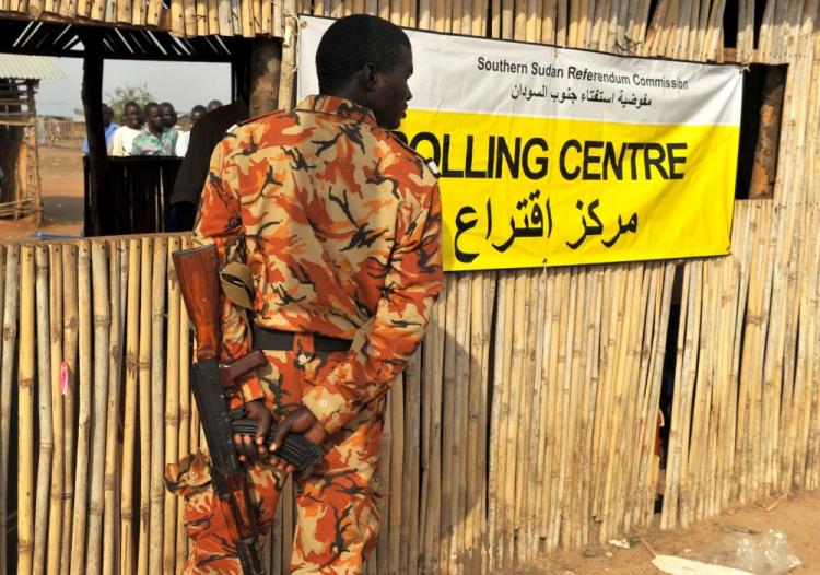 A soldier guards a polling station in Juba, on Jan. 9, on the first day of a week-long independence referendum expected to lead to the partition of Africa's largest nation and the creation of the world's 193rd U.N. member state. (Roberto Schmidt/AFP/Getty Images) A soldier guards a polling station in Juba, on Jan. 9, on the first day of a week-long independence referendum expected to lead to the partition of Africa's largest nation and the creation of the world's 193rd U.N. member state. (Roberto Schmidt/AFP/Getty Images)