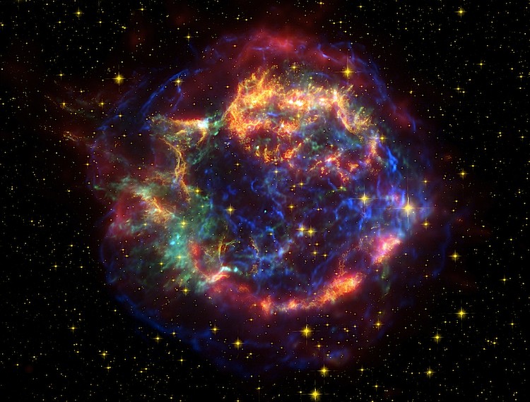 Cassiopeia A is among the best-studied supernova remnants. This image blends data from NASA's Spitzer (red), Hubble (yellow), and Chandra (green and blue) observatories. (NASA/JPL-Caltech/STScI/CXC/SAO)