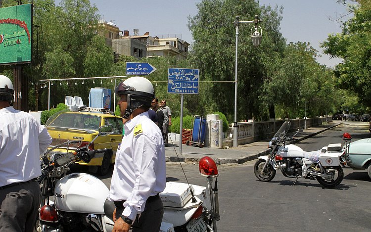 Syrian police guard the road Syrian police guard the road