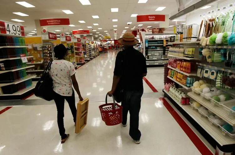 Shoppers walk through Target's Harlem store last month in New York City. The latest consumer sentiment readings show a much grimmer view of the economy. (Chris Hondros/Getty Images)
