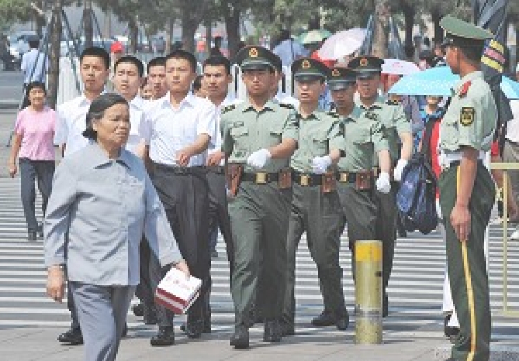 Chinese paramilitary police march into Tiananmen Square in Beijing on June 4, 2008. China has stepped up security in central Beijing ahead of the Olympics. (Mark Ralston/AFP/getty Images) Chinese paramilitary police march into Tiananmen Square in Beijing on June 4, 2008. China has stepped up security in central Beijing ahead of the Olympics. (Mark Ralston/AFP/getty Images)