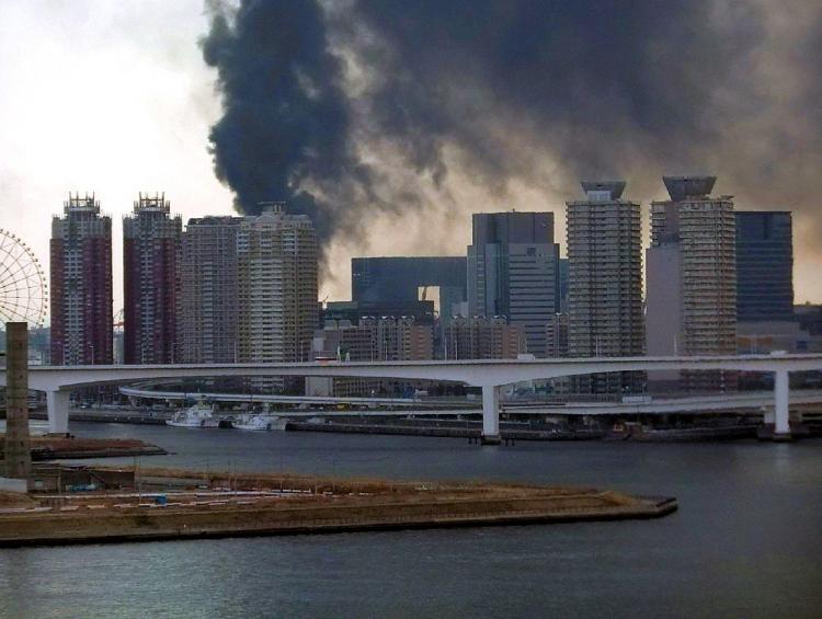 Black smoke raises from a building in Tokyo's waterfront Daiba in Tokyo on March 11, 2011.  (STR/AFP/Getty Images)