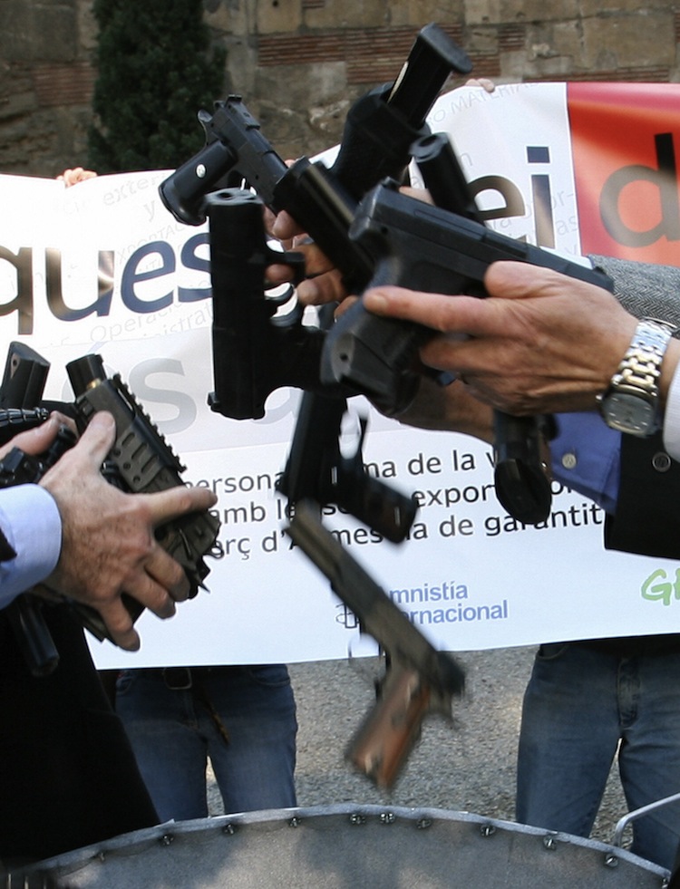 Activists of Amnesty International, Oxfam and Greenpeace protest against Spanish arms exports, February 6th, 2007 in Barcelona. (Lluis Gene/AFP/Getty Images)