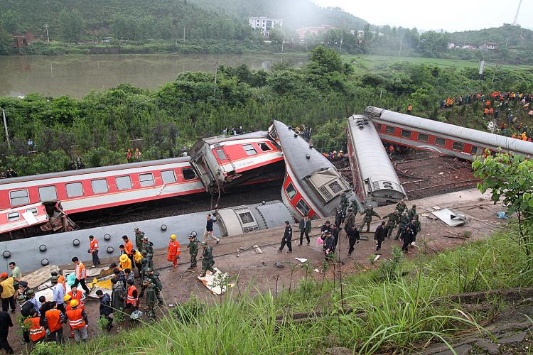 Rescuers check the twisted wreckage of a train that derailed in Dongxiang County, in eastern China's Jiangxi Province. The train was headed from Shanghai to the tourist city of Guilin. (AFP/Getty Images) Rescuers check the twisted wreckage of a train that derailed in Dongxiang County, in eastern China's Jiangxi Province. The train was headed from Shanghai to the tourist city of Guilin. (AFP/Getty Images)