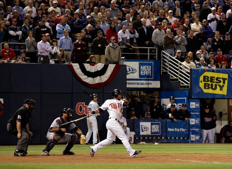 WALK OFF SINGLE: Alexi Casilla of the Minnesota Twins drives in game-winning run as the Twins defeat the Detroit Tigers to win the American League tiebreaker 6-5 in 12 innings. (Jamie Squire/Getty Images) WALK OFF SINGLE: Alexi Casilla of the Minnesota Twins drives in game-winning run as the Twins defeat the Detroit Tigers to win the American League tiebreaker 6-5 in 12 innings. (Jamie Squire/Getty Images)