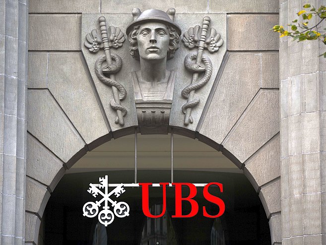 The logo of Swiss banking giant UBS is seen on Oct. 13 in Zurich. The bank could announce layoffs of 10,000 employees this week at its earnings release on Oct. 30. Fabrice Coffrini/AFP/Getty Images The logo of Swiss banking giant UBS is seen on Oct. 13 in Zurich. The bank could announce layoffs of 10,000 employees this week at its earnings release on Oct. 30. (Fabrice Coffrini/AFP/Getty Images)