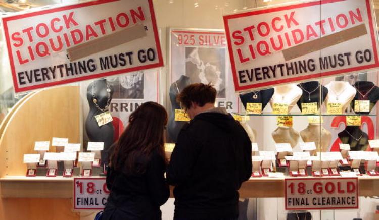 A couple look at the jewelery for sale in a shop adorned with posters advertising ' Stock Liquidation ' on Bond Street in London. (Oli Scarff/Getty Images) A couple look at the jewelery for sale in a shop adorned with posters advertising ' Stock Liquidation ' on Bond Street in London. (Oli Scarff/Getty Images)