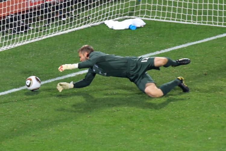 BIG MISTAKE: England's Robert Green sees the ball slip through his hands and into the net. (Martin Rose/Getty Images)