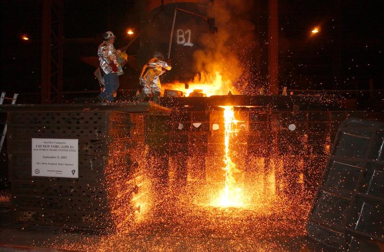 In this file handout photo, workers pour steel, recycled from the World Trade Center, into a mold, which will form the bow stem of the Amphibious Transport Dock ship USS New York at Amite, Louisiana. USS New York set sail from Louisiana to New York City t (George Trian/U.S. Navy via Getty Images) In this file handout photo, workers pour steel, recycled from the World Trade Center, into a mold, which will form the bow stem of the Amphibious Transport Dock ship USS New York at Amite, Louisiana. USS New York set sail from Louisiana to New York City t (George Trian/U.S. Navy via Getty Images)