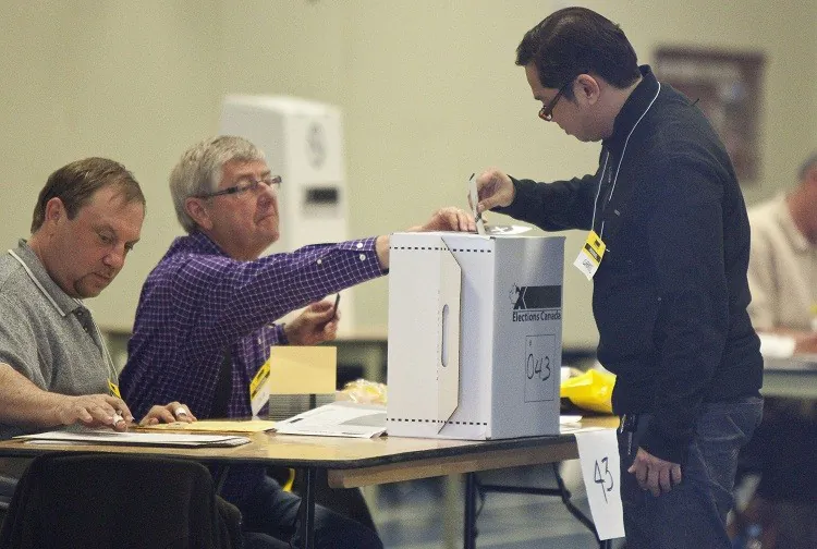 A voter casts his ballot in Canada's federal election at a polling station in Calgary, Alberta, on May 2, 2011. (Geoff Robins/AFP/Getty Images)