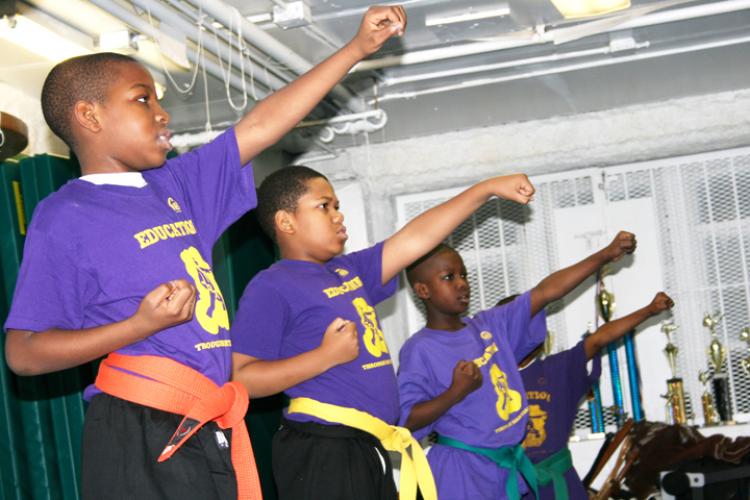 Harlem kids learn the old school karate way, which focuses on shaping a strong mind and moral character as well as the karate techniques. The teacher, Master Thorton believes the values of karate discipline can help turn youth in the community away from n (Katy Mantyk/The Epoch Times) Harlem kids learn the old school karate way, which focuses on shaping a strong mind and moral character as well as the karate techniques. The teacher, Master Thorton believes the values of karate discipline can help turn youth in the community away from n (Katy Mantyk/The Epoch Times)