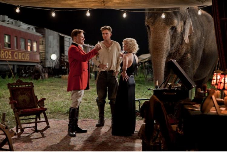 LOVE QUADRILATERAL: Christoph Waltz, Robert Pattinson, Reese Witherspoon, and Rosie the elephant in a scene from the film Water for Elephants. (David James/Twentieth Century Fox Film Corp.) LOVE QUADRILATERAL: Christoph Waltz, Robert Pattinson, Reese Witherspoon, and Rosie the elephant in a scene from the film Water for Elephants. (David James/Twentieth Century Fox Film Corp.)