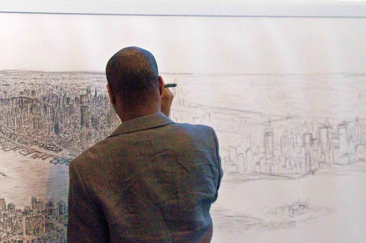 DRAWING THE CITY: Autistic artist Stephen Wiltshire draws Manhattan from memory at the Pratt Institute, in Brooklyn. (Dan Skorbach/The Epoch Times) DRAWING THE CITY: Autistic artist Stephen Wiltshire draws Manhattan from memory at the Pratt Institute, in Brooklyn. (Dan Skorbach/The Epoch Times)