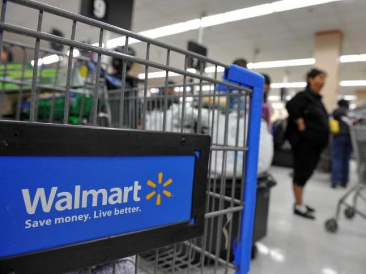 The world's largest retailer Wal-Mart Stores Inc. has announced that it will end profit-sharing contributions that have been automatically distributed since 1971. (Robyn Beck/AFP/Getty Images)