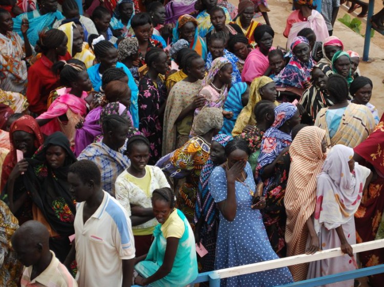 WOMEN LINEUP FOR RATION CARDS: A crowd awaits emergency rations at a food distribution event in Wau, South Sudan. (World Concern)