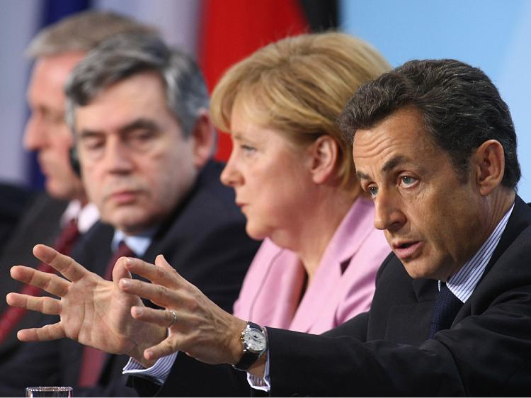 French President Nicolas Sarkozy (R) speaks to the media after a meeting of European Union leaders at the Chancellery as German Chancellor Angela Merkel, British Prime Minister Gordon Brown and Czech Prime Minister Mirek Topolanek (L) listen on February 2 (Sean Gallup/Getty Images) French President Nicolas Sarkozy (R) speaks to the media after a meeting of European Union leaders at the Chancellery as German Chancellor Angela Merkel, British Prime Minister Gordon Brown and Czech Prime Minister Mirek Topolanek (L) listen on February 2 (Sean Gallup/Getty Images)