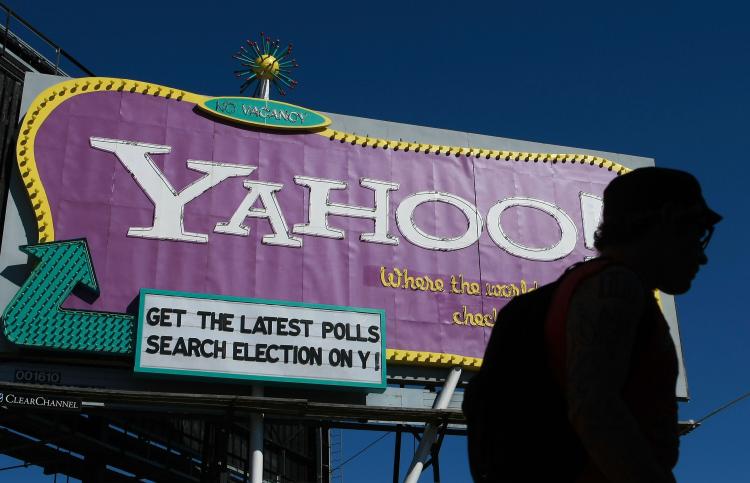 A pedestrian walks by a Yahoo billboard October 21, 2008 in San Francisco, California. Yahoo reported a fourth-quarter loss of $303 million as CEO Jerry Yang exited after a tumultuous tenure as CEO. (Justin Sullivan/Getty Images) A pedestrian walks by a Yahoo billboard October 21, 2008 in San Francisco, California. Yahoo reported a fourth-quarter loss of $303 million as CEO Jerry Yang exited after a tumultuous tenure as CEO. (Justin Sullivan/Getty Images)