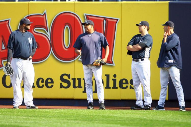 Yankees bullpen coach Mike Harkey (center) has been getting starting pitchers CC Sabathia (L), Phil Hughes (second from right), and Andy Pettitte (R) ready for the ALCS against the Texas Rangers. (Andrew Burton/Getty Images) Yankees bullpen coach Mike Harkey (center) has been getting starting pitchers CC Sabathia (L), Phil Hughes (second from right), and Andy Pettitte (R) ready for the ALCS against the Texas Rangers. (Andrew Burton/Getty Images)
