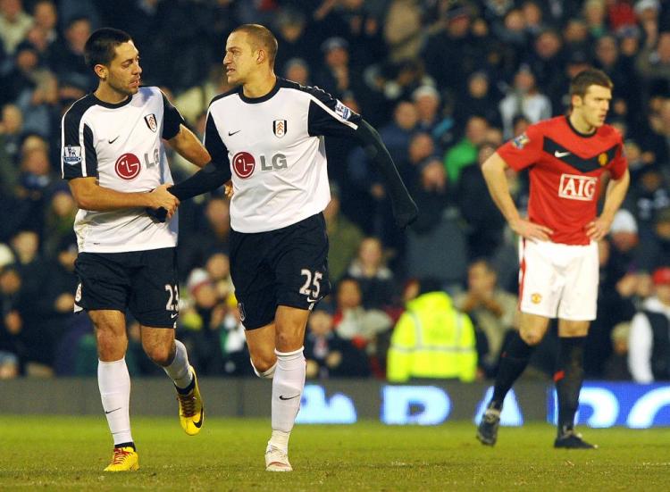 American Clint Dempsey (left) congratulates Bobby Zamora who scored Fulham's second goal. (Carl de Souza/AFP/Getty Images) American Clint Dempsey (left) congratulates Bobby Zamora who scored Fulham's second goal. (Carl de Souza/AFP/Getty Images)