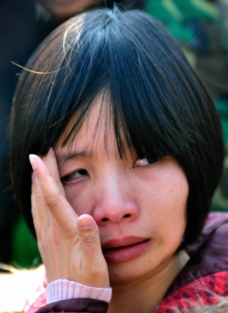 Zeng Jinyan, the wife of human rights activist Hu Jia weeps outside a courthouse after her husband was sentenced to three years jail in April this year. (Teh Eng Koon/AFP/Getty Images) Zeng Jinyan, the wife of human rights activist Hu Jia weeps outside a courthouse after her husband was sentenced to three years jail in April this year. (Teh Eng Koon/AFP/Getty Images)