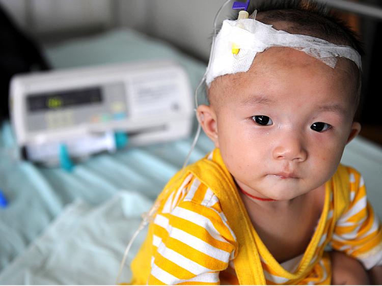 A baby who suffers from kidney stones after drinking tainted milk powder, gets IV treatment at the Chengdu Children's Hospital in Chengdu, China. (China Photos/Getty Images) A baby who suffers from kidney stones after drinking tainted milk powder, gets IV treatment at the Chengdu Children's Hospital in Chengdu, China. (China Photos/Getty Images)