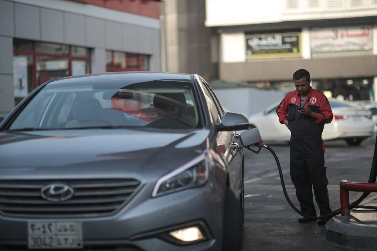 In this Wednesday, Sept. 16, 2015, photo, a car fills up at a gas station in Jiddah, Saudi Arabia. (AP Photo/Mosa'ab Elshamy)