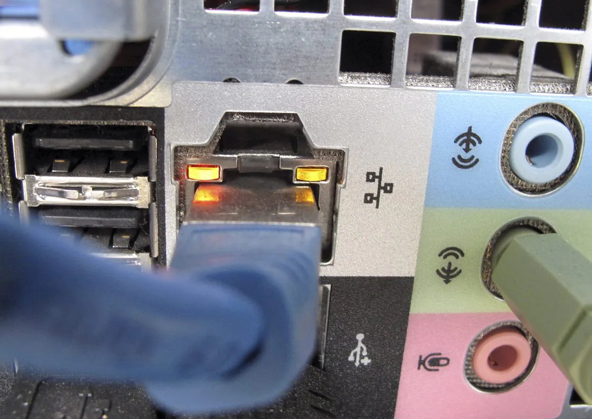 A network cable plugged into the back of a computer in Duesseldorf, Germanyk on Oct. 8, 2009. Cybercrime costs are climbing for companies both in the United States and overseas amid a slew of high-profile breaches, according to research released on Oct. 6, 2015. (AP Photo/Frank Augstein)