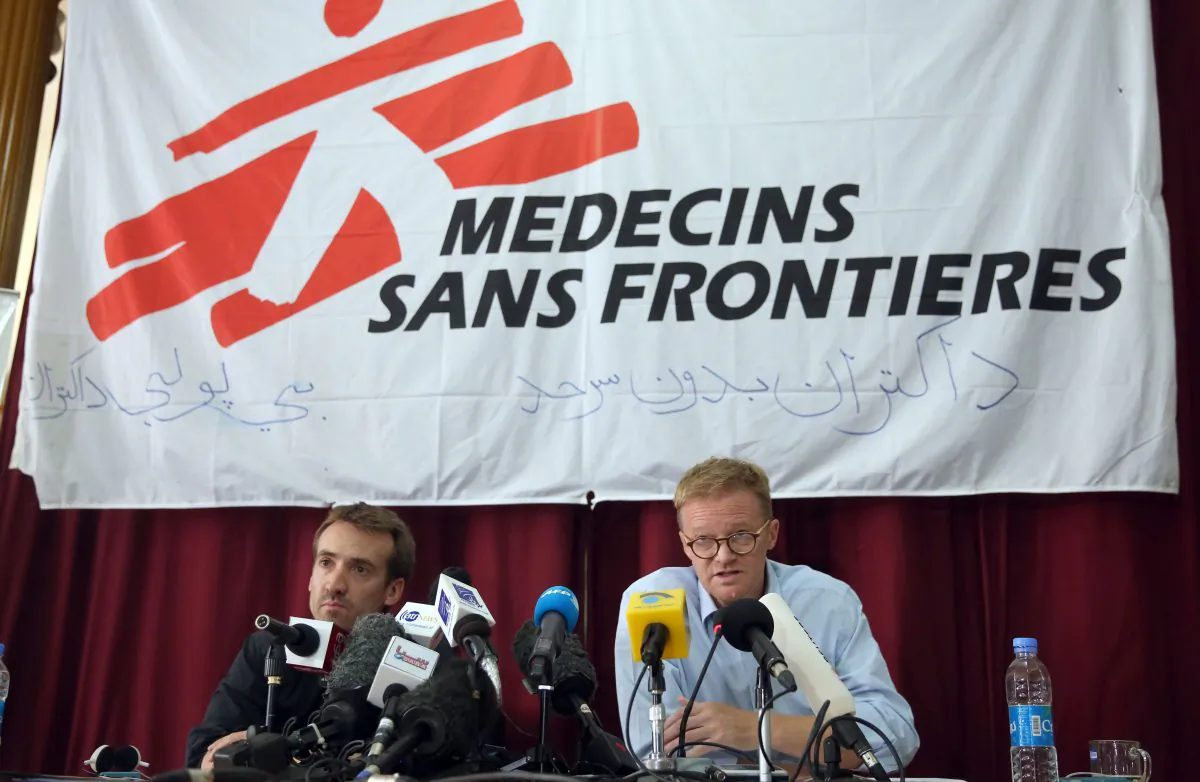 The general director of medical charity, Medecins Sans Frontieres (MSF), Christopher Stokes, right, talks as MSF's Country Representative for Afghanistan, Guilhem Molinie, left, listens, during a press conference at their office, in Kabul, Afghanistan, Thursday, Oct. 8, 2015. (AP Photos/Massoud Hossaini)