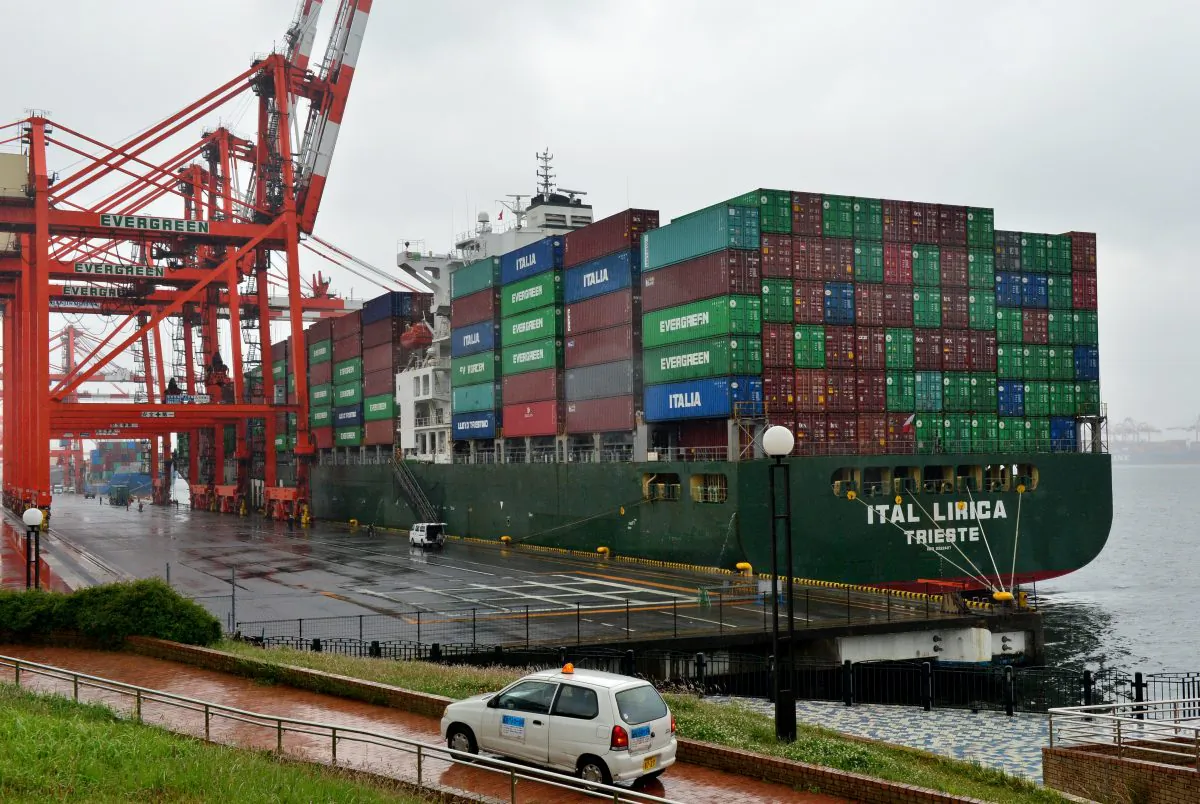 Shipping containers are loaded onto an international freighter at the international cargo terminal in Tokyo on May 21, 2014. (Yoshikazu Tsuno/AFP/Getty Images)