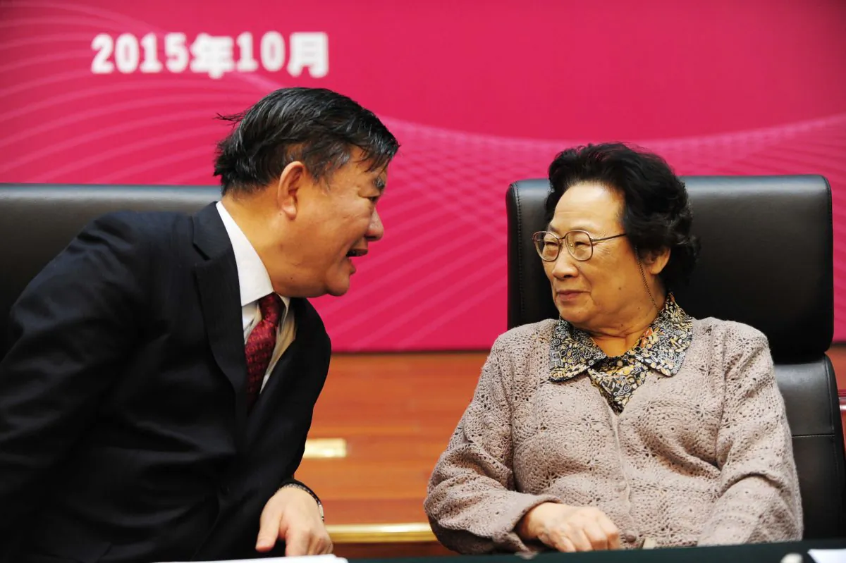 Tu Youyou (R), the first Chinese woman to win a Nobel prize for medicine, attends a symposium organized by China's National Health and Family Planning Commission (NHFPC) and other departments in Beijing on October 8, 2015. (STR/AFP/Getty Images)