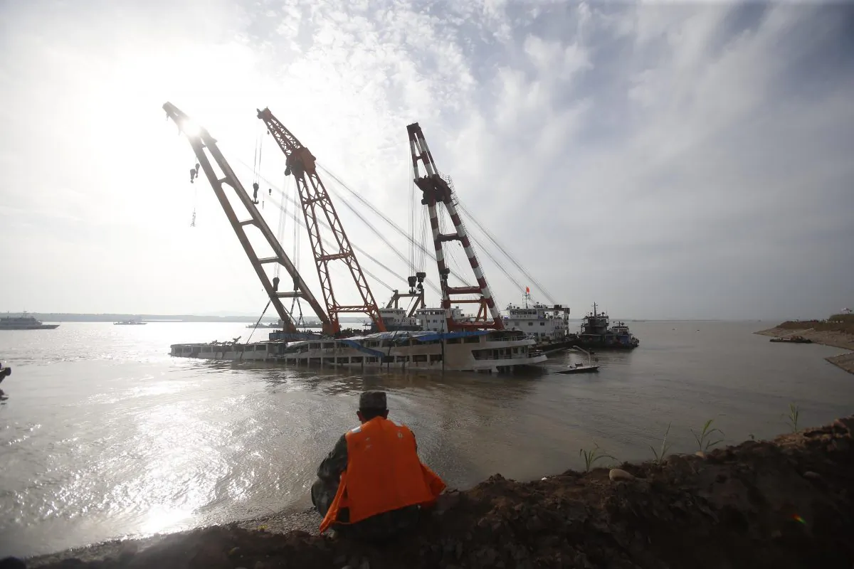 Rescuers work to raise the capsized ship Dongfangzhixing in the Yangtze River in Jingzhou, China,  on June 5, 2015. (ChinaFotoPress/ChinaFotoPress via Getty Images)