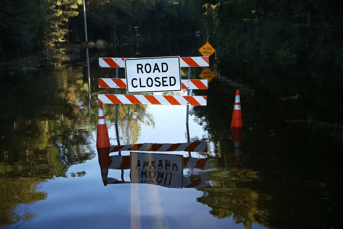 A road closed sign is seen on a flooded road as water that breached dams upstream reach areas in the eastern part of the state on October 8, 2015 in Givhans South Carolina. (Joe Raedle/Getty Images)