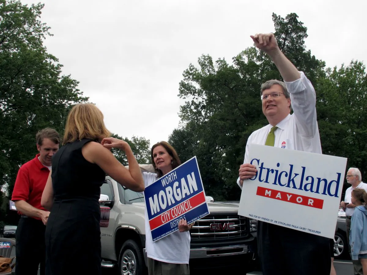 In  this  Sept. 30, 2015 file photo Memphis mayoral candidate Jim Strickland, right, waves at voters at an early voting location in Memphis. (AP Photo/Adrian Sainz)