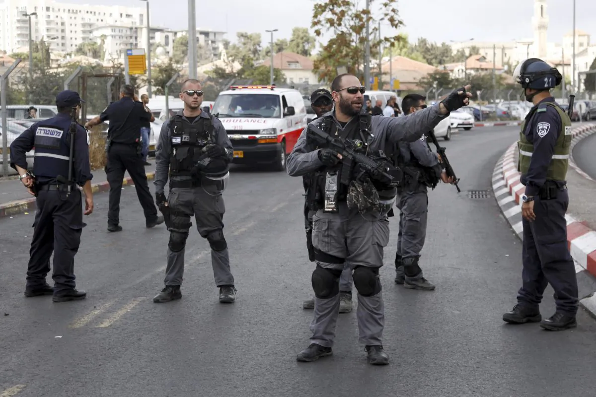 Israeli police secure the scene of a stabbing attack in Jerusalem, Saturday, Oct. 10, 2015. (AP Photo/Mahmoud Illean)