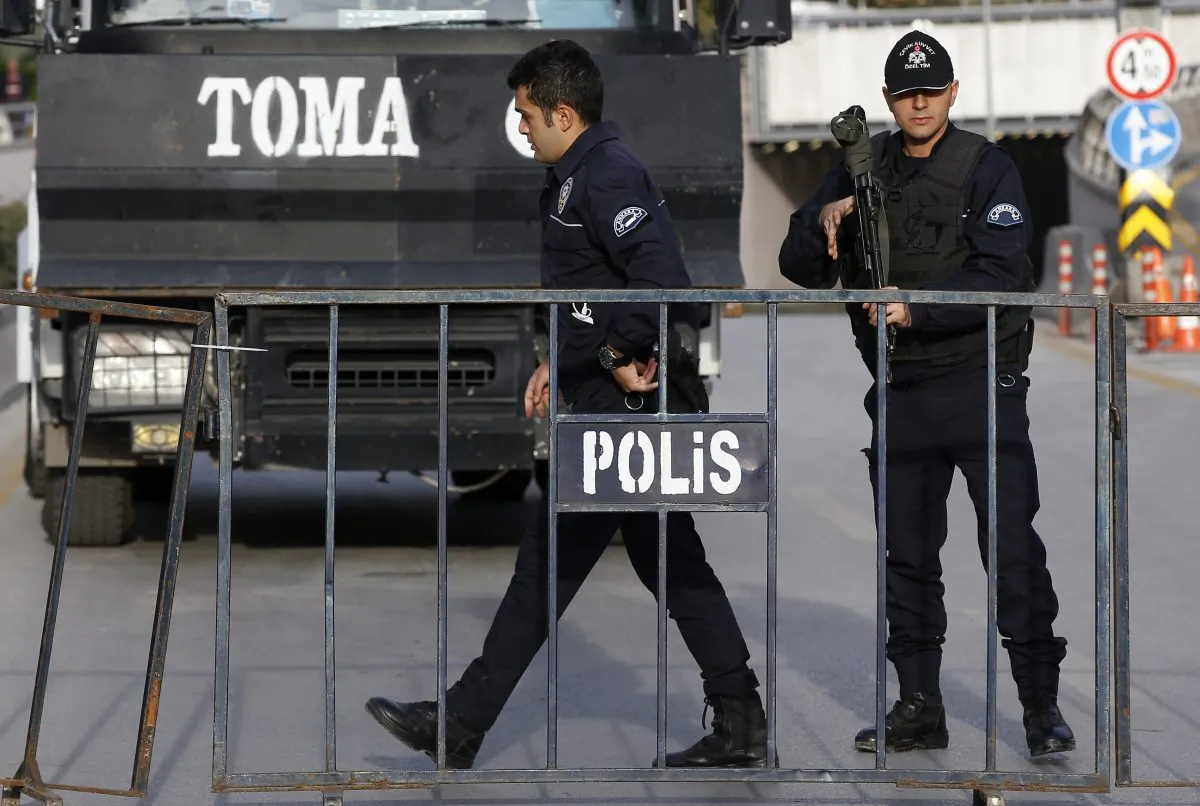 Turkish police block the way to the site of Saturday's explosions in Ankara, Turkey, Sunday, Oct. 11, 2015. (AP Photo/Emrah Gurel)