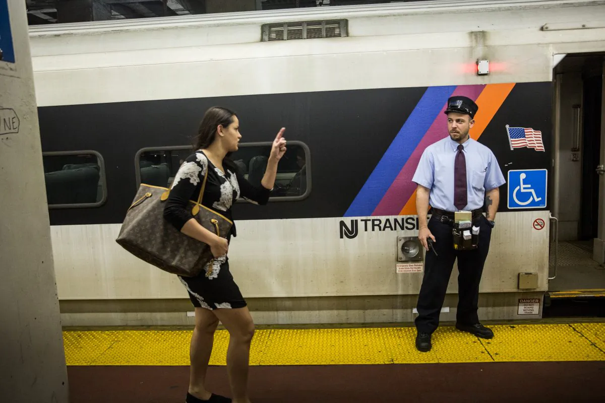 A woman rushes to catch the N.J. Transit train from New York Penn Station to Trenton, N.J., in New York City on May 13, 2015. (Andrew Burton/Getty Images)