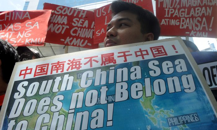 Activists hold a protest in front of the Chinese Consular Office in Manila, Philippines, on July 7, 2015, against China's claims, construction activities, and military build-up on the South China Sea. (Jay Directo/AFP/Getty Images)