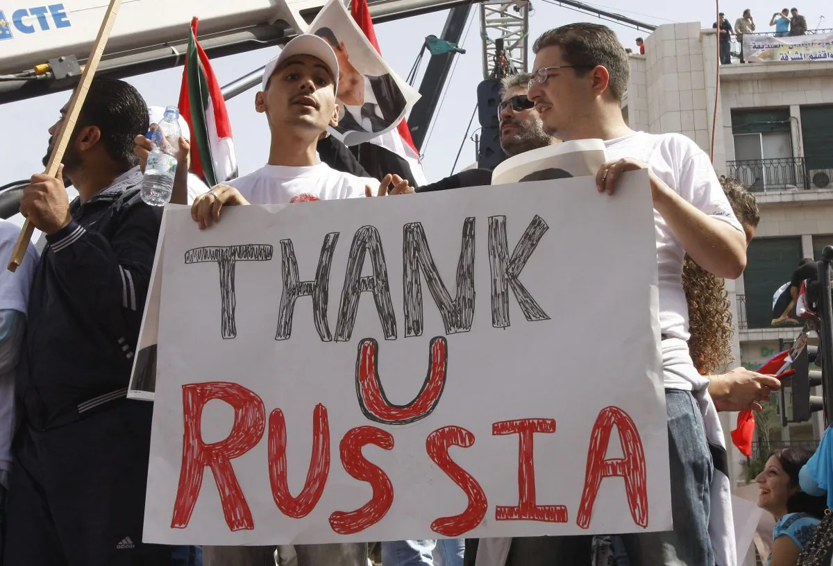 Supporters of the Syrian government hold a pro-Russian banner, during a demonstration in Damascus, Syria, on Oct. 12, 2011, as they show their support for Syrian President Bashar Assad and to thank Russia and China for blocking a U.N. Security Council resolution condemning Syria for its brutal crackdown. (AP Photo/Muzaffar Salman)