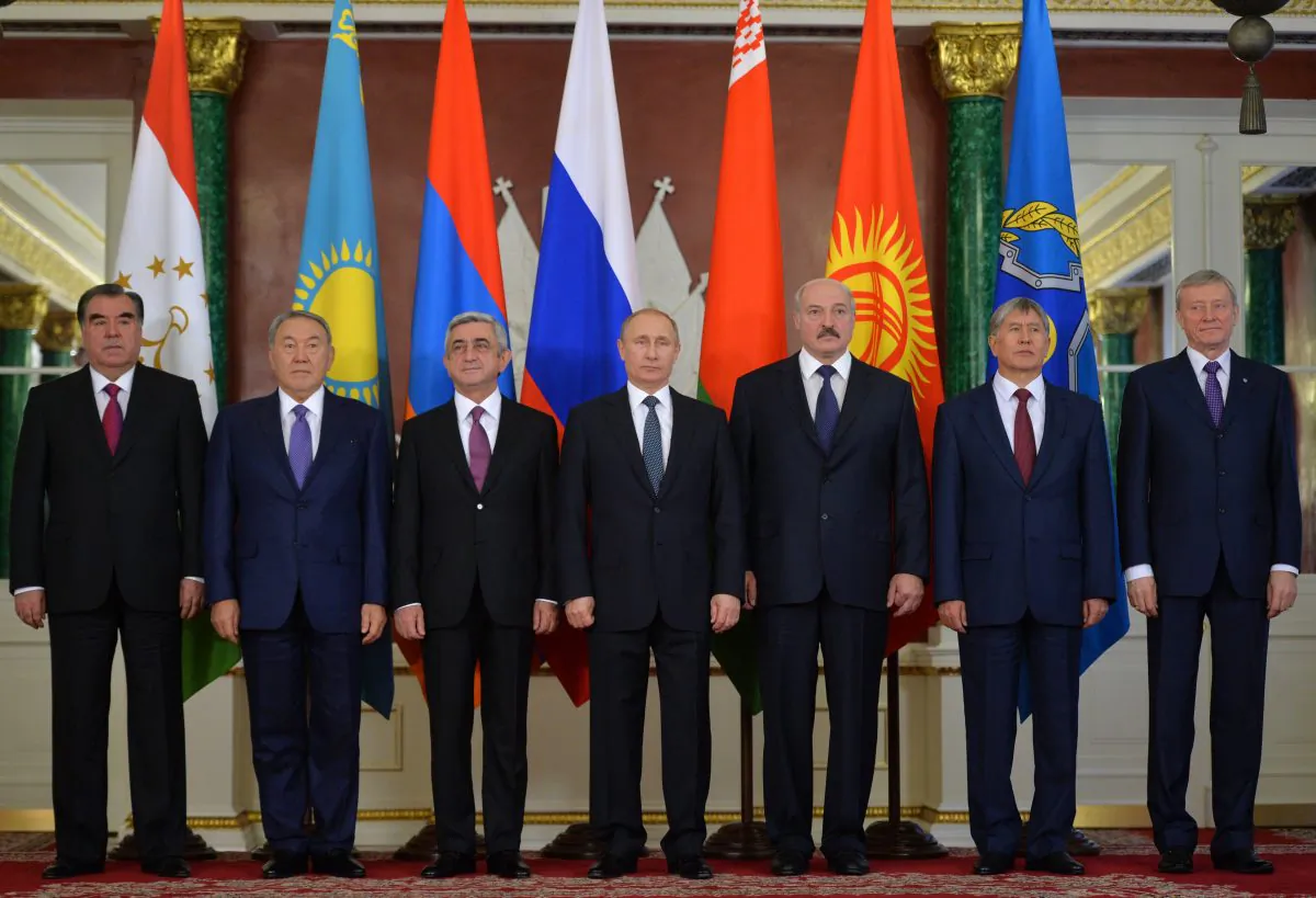 (L-R) Presidents of Tajikistan Emomali Rakhmon, Kazakhstan Nursultan Nazarbayev, Armenia Serge Sarkisian, Russia Vladimir Putin, Belarus Alexander Lukashenko, Kyrgyzstan Almazbek Atambayev, and the CSTO Secretary General Nikolai Bordyuzha at the Collective Security Treaty Organization summit in Moscow's Kremlin, Russia, on Dec. 23, 2014. (Alexei Druzhinin/Presidential Press Service/RIA Novosti via AP)