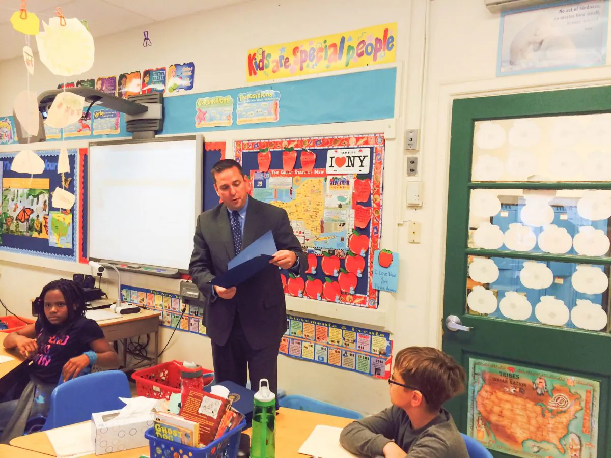 Orange County Executive Steven Neuhaus reads a proclamation for Mastodon Day in Orange County to a fourth grade class at Willow Avenue Elementary School in Corwall on Oct. 14, 2015. (Holly Kellum/Epoch Times)