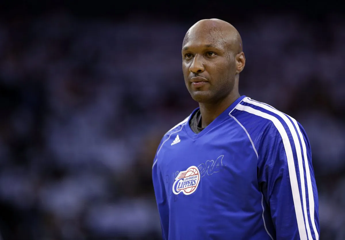 FILE - This Jan. 2, 2013 file photo shows Los Angeles Clippers' Lamar Odom (7) in action against the Golden State Warriors during an NBA basketball game in Oakland, Calif. Authorities say former NBA and reality TV star Odom has been hospitalized after he was found unconscious at a Nevada brothel. Nye County Sheriff Sharon A. Wehrly says the department got a call Tuesday afternoon, Oct. 13, 2015, requesting an ambulance for an unresponsive man at the Love Ranch in Crystal, Nevada about 70 miles outside of Las Vegas. (AP Photo/Marcio Jose Sanchez, File)